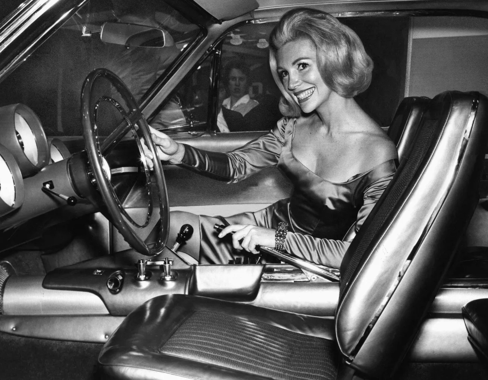 A promotional model for Chrysler shows off the controls on the console of the new gas turbine